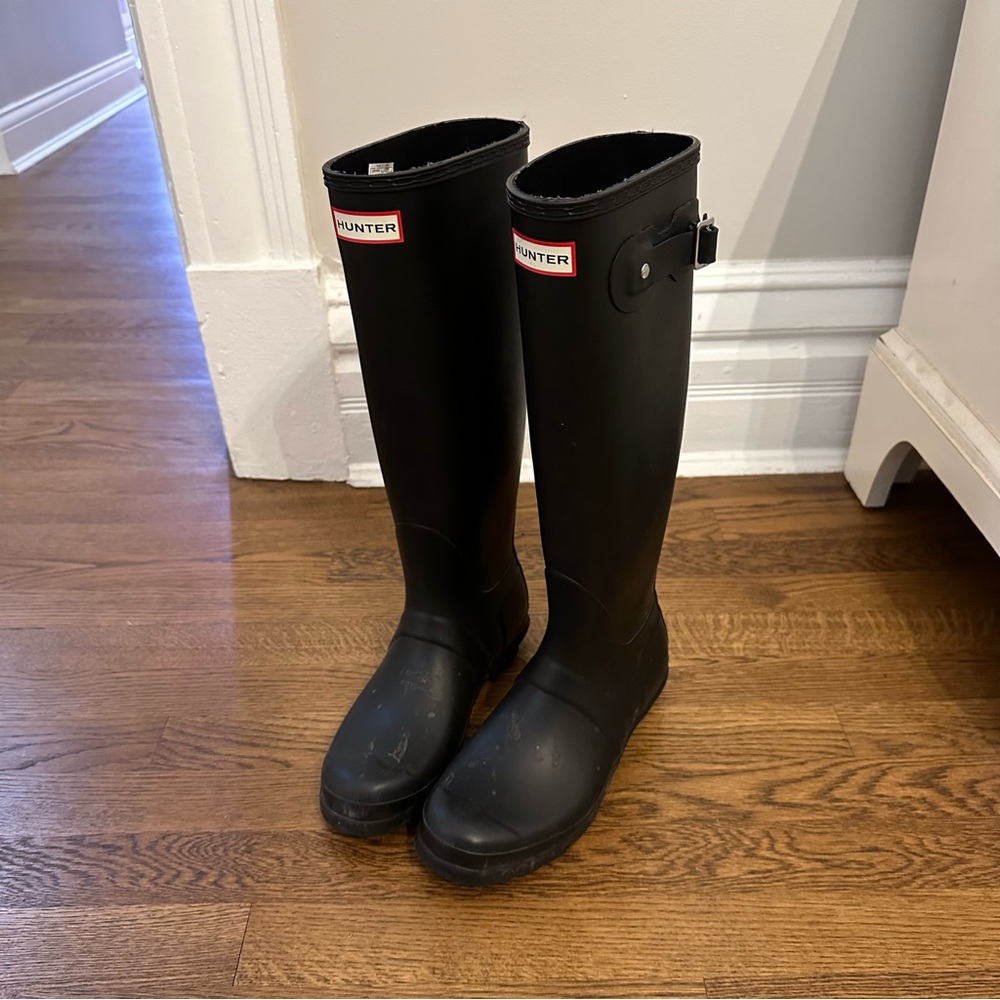 Tall black hunter boots